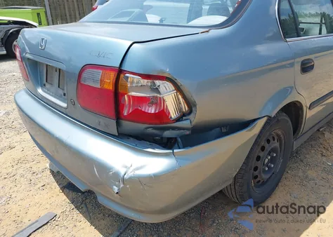 2000 Honda Civic Lx z USA, uszkodzony, nr VIN 1HGEJ667XYL047025